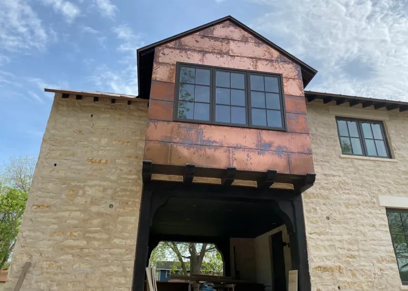Copper metal panel facade on a stone building for Skylight Installation in San Francisco